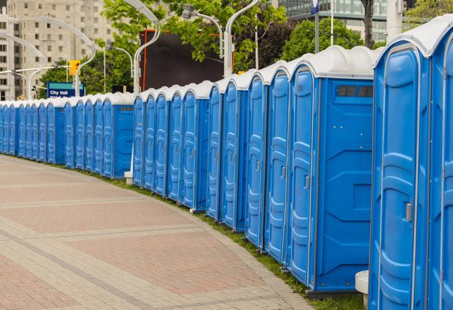 a row of portable restrooms at an outdoor special event, ready for use in Doraville, GA